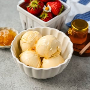 This homemade honey ice cream recipe features a rich, creamy texture with the natural sweetness of real honey and no added refined sugars. This is such a nourishing ice cream recipe with dried milk powder and egg yolks for extra protein and rich custard flavor. This Walt's Dream Ice cream is healthier version of homemade ice cream!